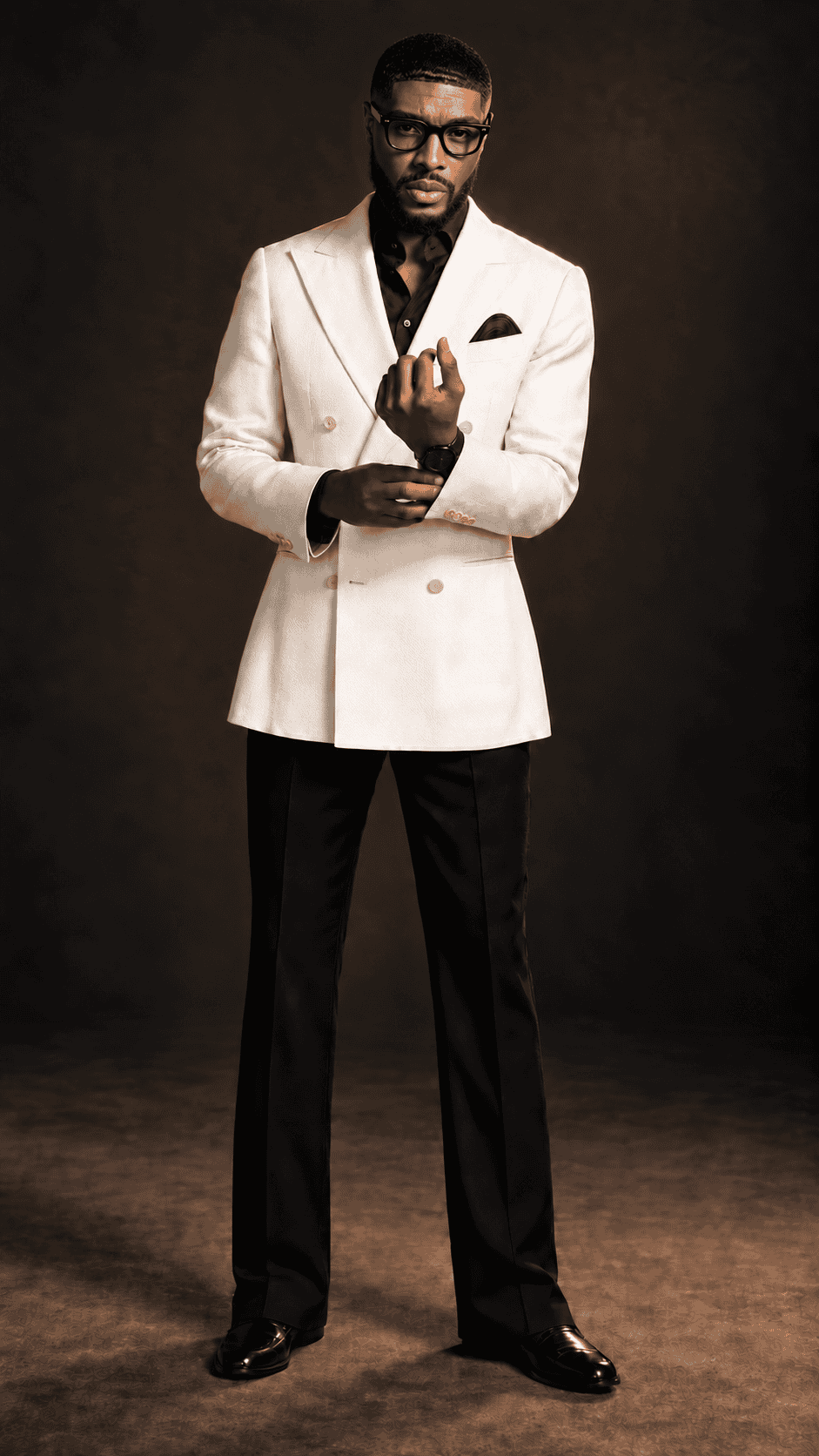 Personal injury attorney Korey Huff standing in an ivory suit